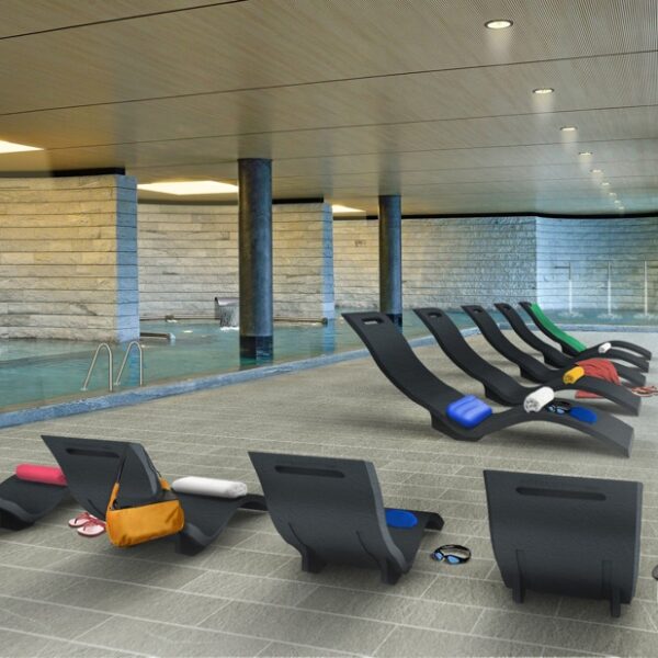 The black SERENDIPITY water loungers by ARKEMA DESIGN by the pool