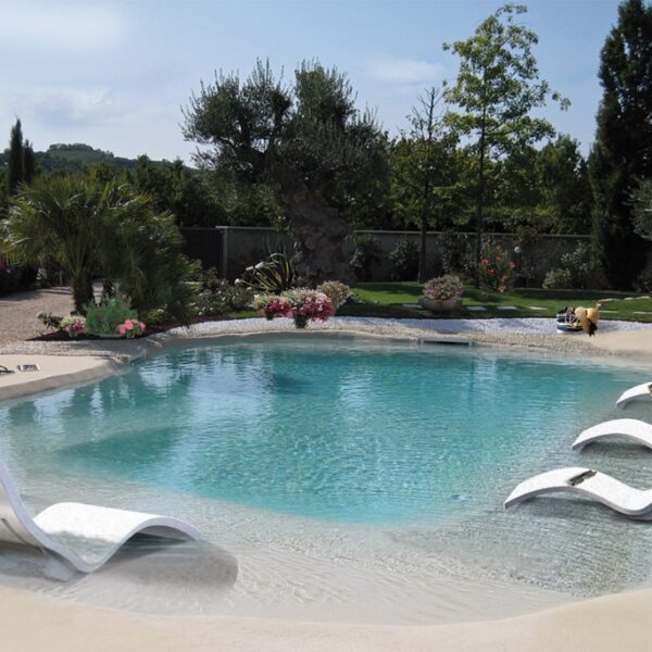 The white SERENDIPITY water loungers by ARKEMA DESIGN by the pool